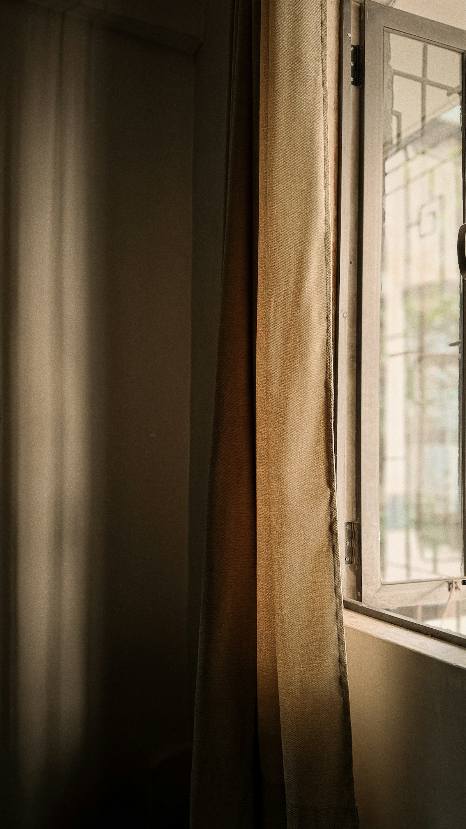 Soft curtains with sunlight streaming through